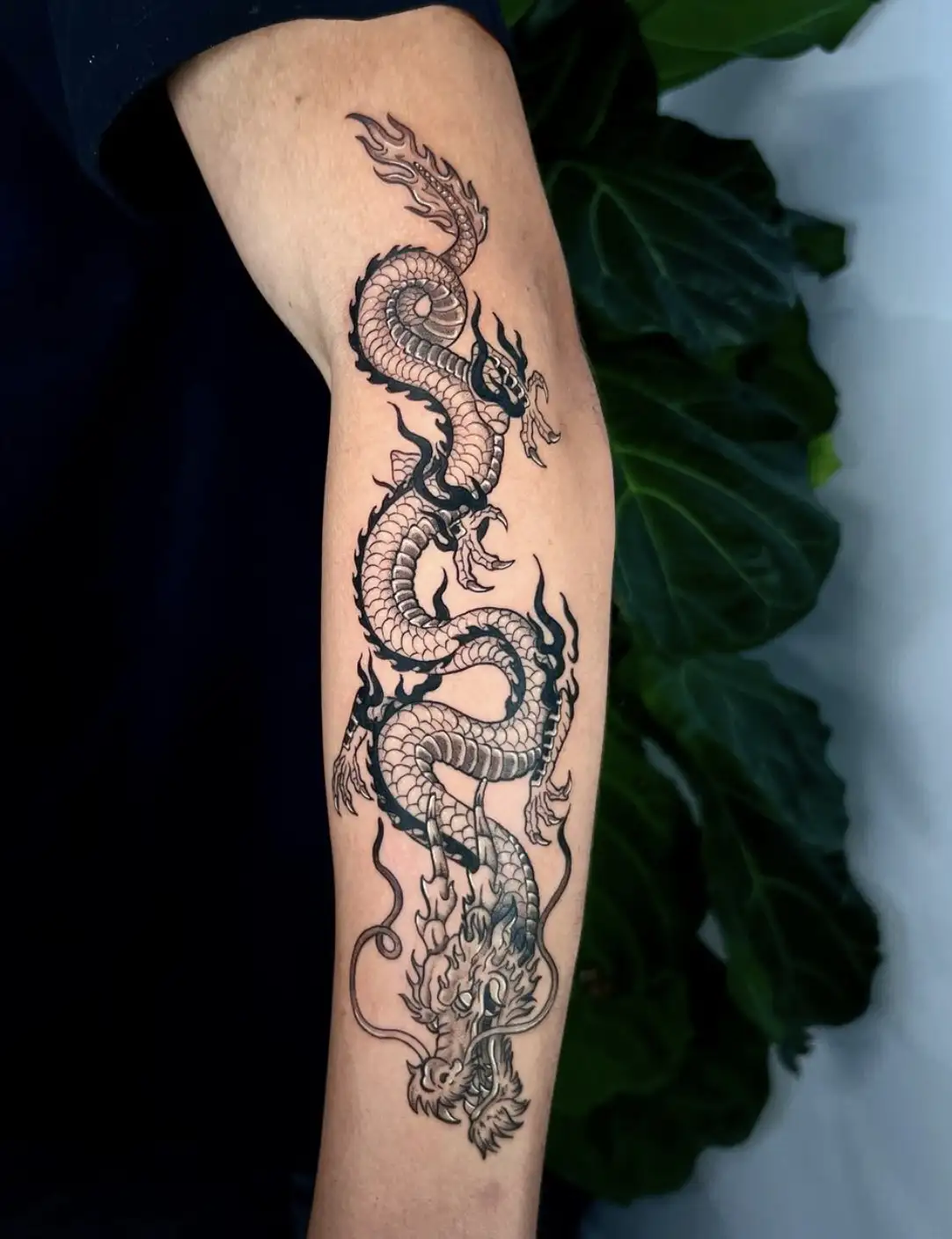 Chinese dragon tattoo with traditional elements and shading by Ayah at Omnia Tattoo Melbourne